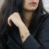 Model Wearing Three Ring Solid Gold Cuff Bangle by Jewelry Lane