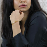 Model Wearing Beautiful Timeless Solid Gold Open Cuff Bangle by Jewelry Lane