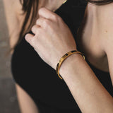 Model Wearing Beautiful Solid Gold Open Cuff Bangle by Jewelry Lane