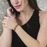 Model Wearing Beautiful Solid Gold Open Cuff Bangle by Jewelry Lane