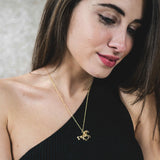 Model Wearing Elegant Beautiful Horse Design Solid Gold Pendant By Jewelry Lane