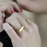 Italian model wearing Beautiful Solid Gold Minimalist Stacker Ring by Jewelry Lane
