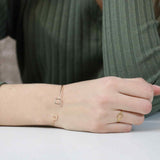 Model Wearing Simple Elegant Square Stacker Solid Gold Ring By Jewelry Lane