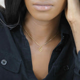 Model Wearing Charming Zodiac Taurus Minimalist Solid Gold Pendant By Jewelry Lane