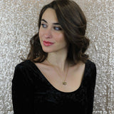 Model Wearing Beautiful XO Hugs And Kisses Solid Gold Pendant By Jewelry Lane