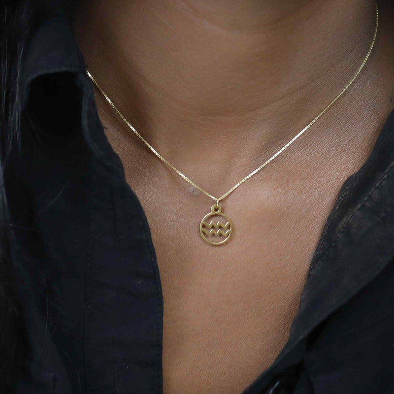 Model Wearing Charming Zodiac Aquarius Minimalist Solid Gold Pendant By Jewelry Lane