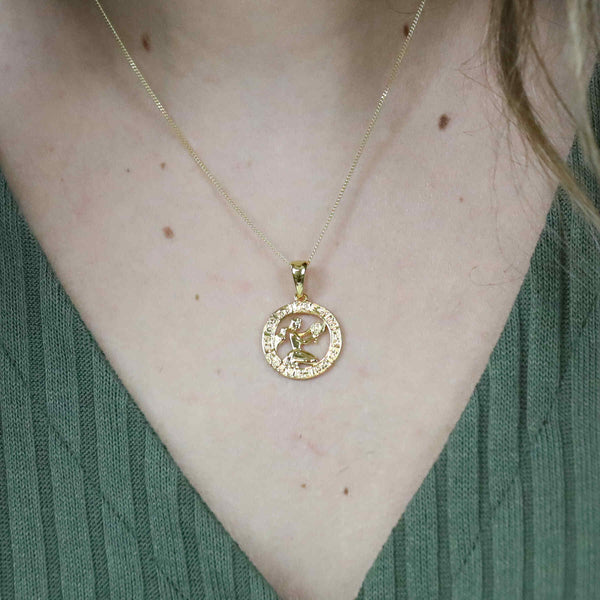 Model Wearing Beautiful Zodiac Aquarius Solid Gold Pendant By Jewelry Lane