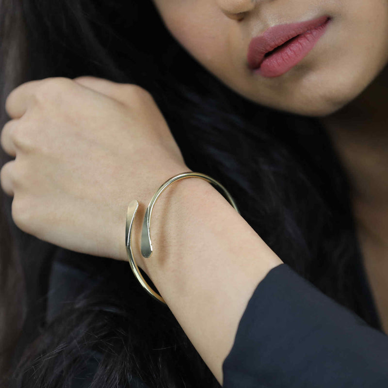 Model Wearing Solid Gold Open Cuff Bangle by Jewelry Lane