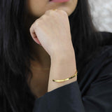 Model Wearing Beautiful Timeless Solid Gold Open Cuff Bangle by Jewelry Lane