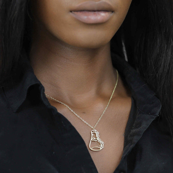 Model Wearing Unique Modern Science Beaker Style Solid Gold Pendant By Jewelry Lane