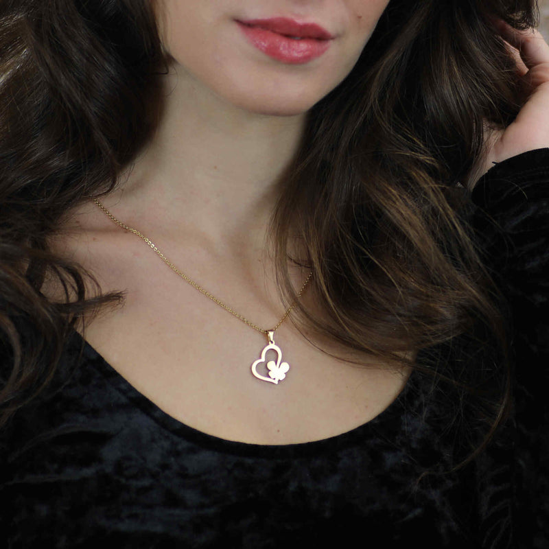 Model Wearing Exquisite Irish Love Butterfly Tilted Heart Solid Gold Pendant By Jewelry Lane