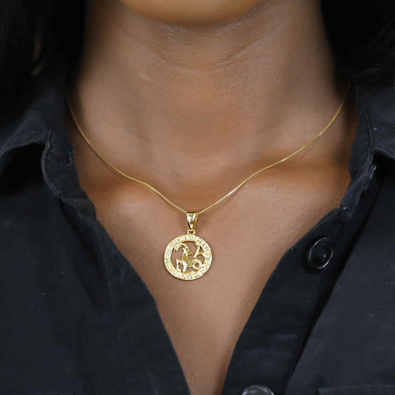 Model Wearing Beautiful Zodiac Capricorn Solid Gold Pendant By Jewelry Lane