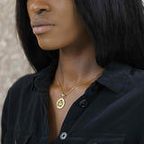 Model Wearing Beautiful Zodiac Capricorn Solid Gold Pendant By Jewelry Lane