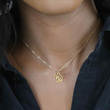 Model Wearing Charming Zodiac Capricorn Minimalist Solid Gold Pendant By Jewelry Lane