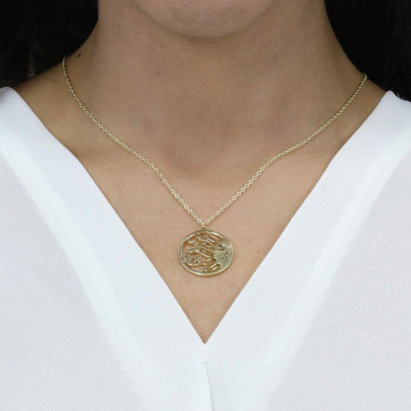 Model Wearing Beautiful Celestial Sun Moon Star Solid Gold Pendant By Jewelry Lane