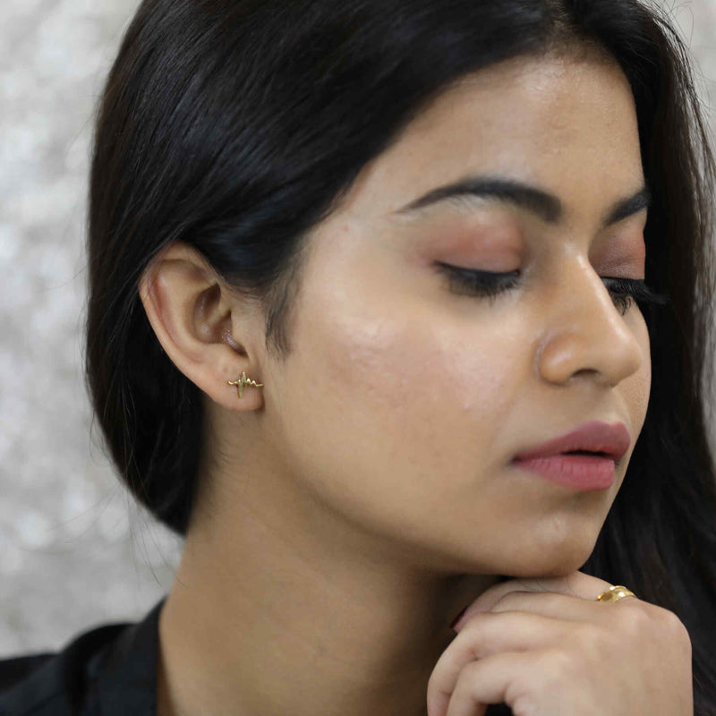 Beautiful Indian Model wearing Solid Gold Heart Beat Earrings by Jewelry Lane