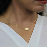 Model Wearing Beautiful Unique Football Solid Gold Pendant By Jewelry Lane