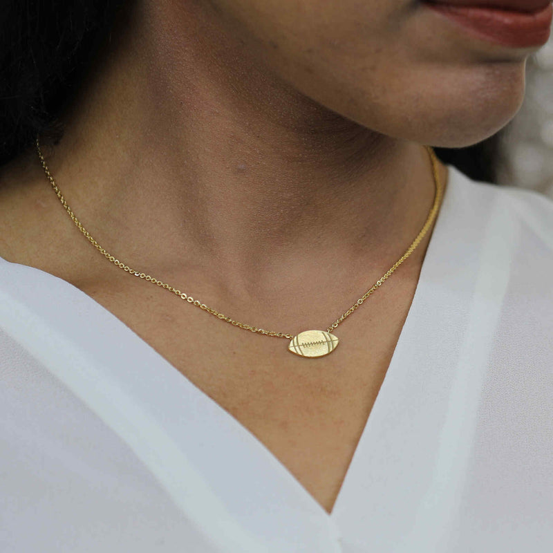 Model Wearing Beautiful Unique Football Solid Gold Pendant By Jewelry Lane