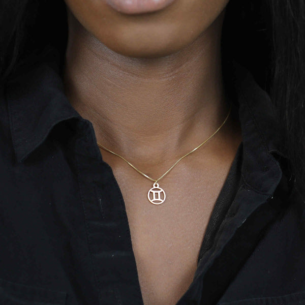 Model Wearing Charming Zodiac Gemini Minimalist Solid Gold Pendant By Jewelry Lane