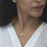 Model Wearing Beautiful Modern Heart In Hand Solid Gold Necklace By Jewelry Lane