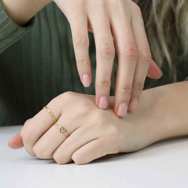 Model Wearing Beautiful Simple Open Heart Love Stacker Solid Gold Ring By Jewelry Lane