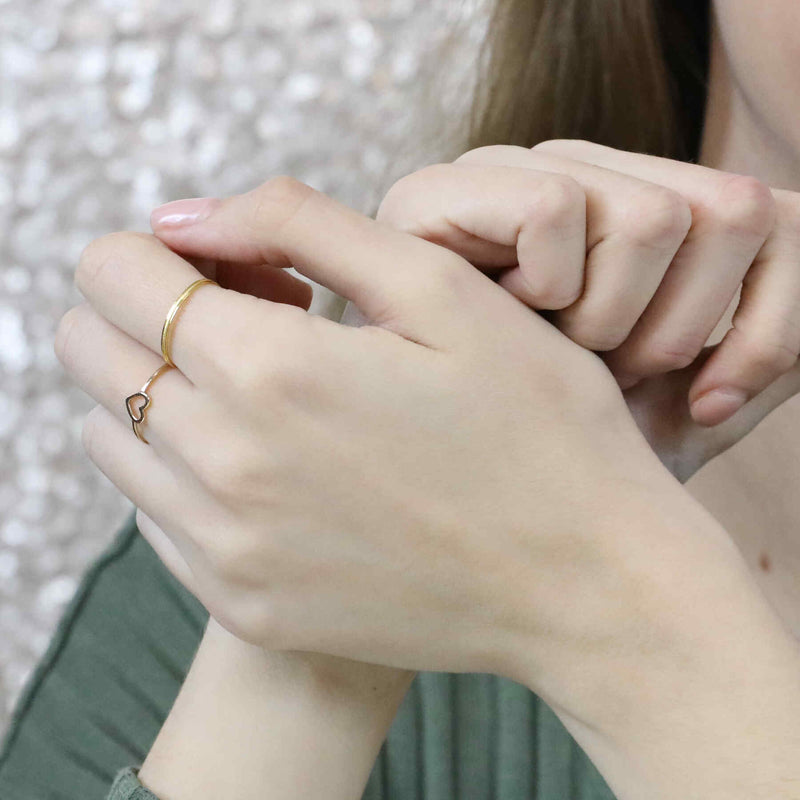 Model Wearing Beautiful Simple Open Heart Love Stacker Solid Gold Ring By Jewelry Lane