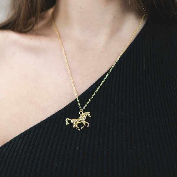 Model Wearing Elegant Beautiful Horse Design Solid Gold Pendant By Jewelry Lane