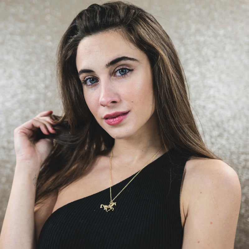 Model Wearing Elegant Beautiful Horse Design Solid Gold Pendant By Jewelry Lane