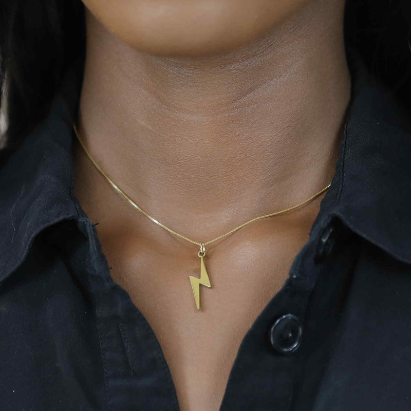 Model Wearing Beautiful Handcrafted Lightning Bolt Solid Gold Pendant By Jewelry Lane