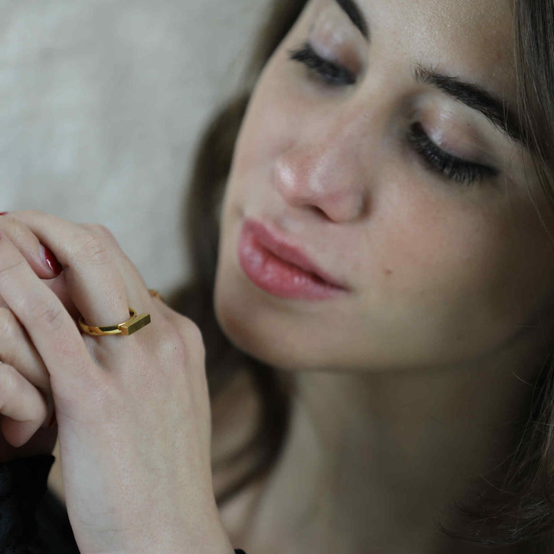 Italian model wearing Beautiful Solid Gold Minimalist Stacker Ring by Jewelry Lane