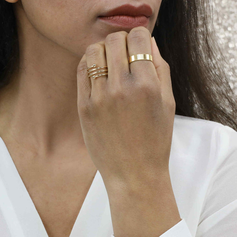 Model Wearing Elegant Simple Spiral Solid Gold Ring By Jewelry Lane