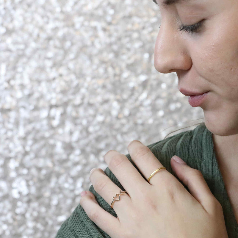 Model Wearing Beautiful Charming Love First Stacker Solid Gold Ring By Jewelry Lane