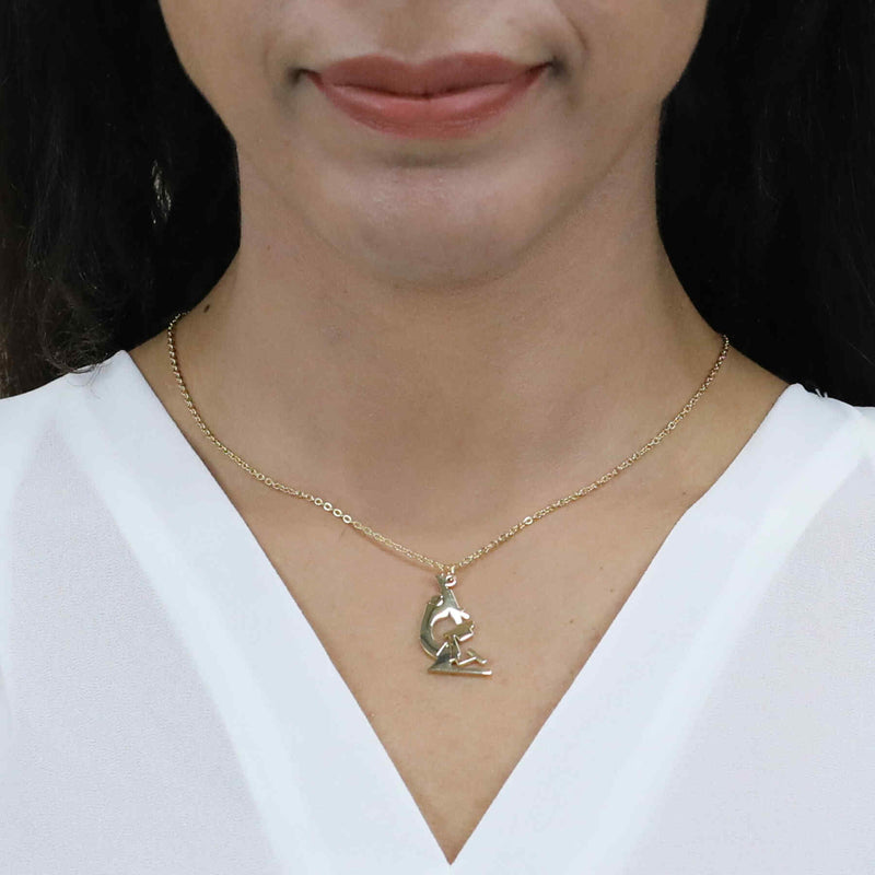 Model Wearing Elegant Unique Microscope Design Solid Gold Pendant By Jewelry Lane
