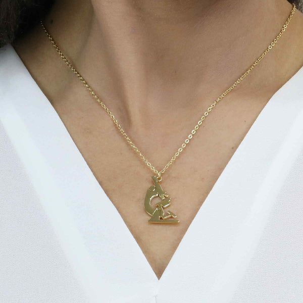 Model Wearing Elegant Unique Microscope Design Solid Gold Pendant By Jewelry Lane