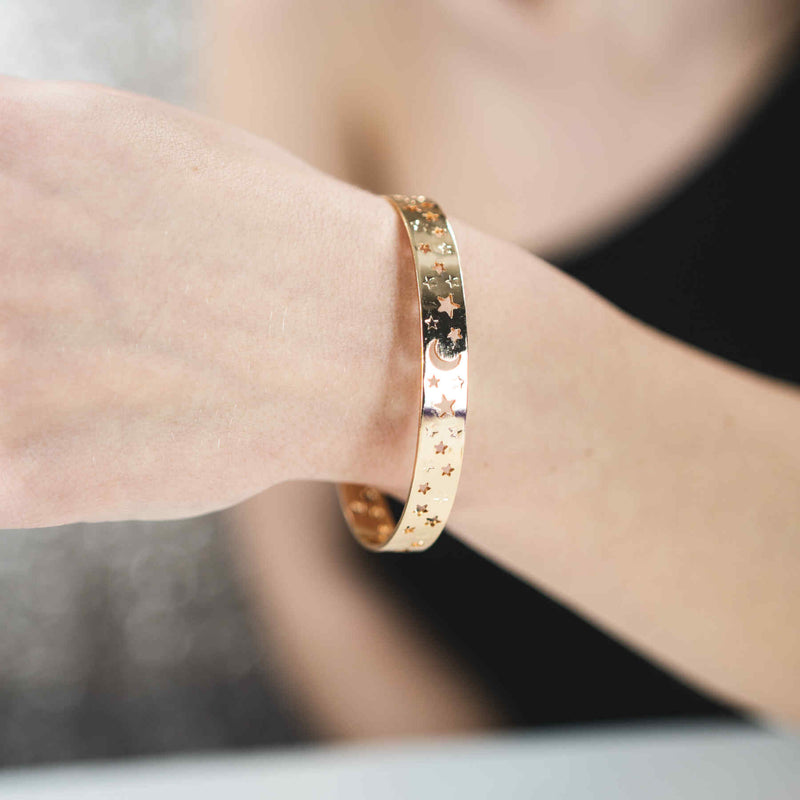 Model Wearing Beautiful Gorgeous Intricately Cut Moon Star Solid Gold Bangle By Jewelry Lane