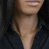 Model Wearing Charming Zodiac Pisces Minimalist Solid Gold Pendant By Jewelry Lane