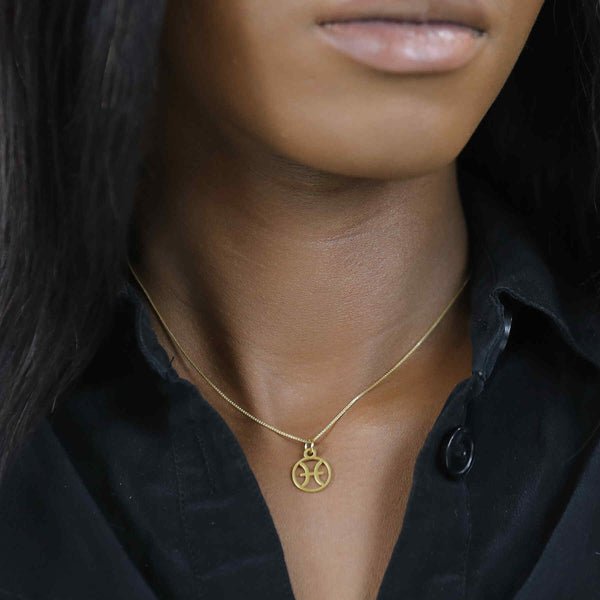 Model Wearing Charming Zodiac Pisces Minimalist Solid Gold Pendant By Jewelry Lane