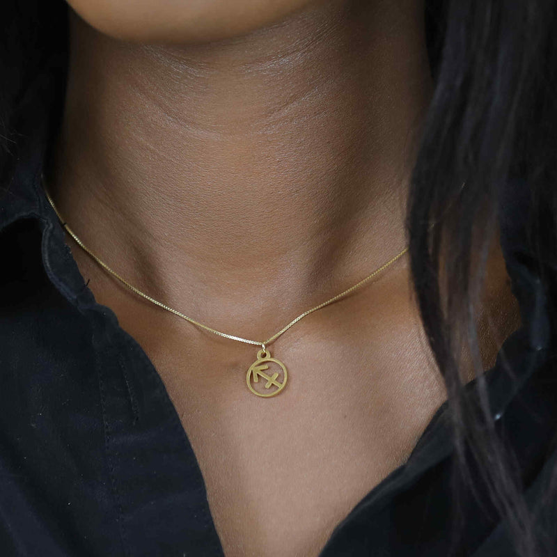 Model Wearing Charming Zodiac Sagittarius Minimalist Solid Gold Pendant By Jewelry Lane