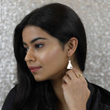 Model Wearing Beautiful Design Science Beaker Solid Gold Love Earrings By Jewelry Lane