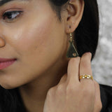 Model Wearing Beautiful Design Science Beaker Solid Gold Love Earrings By Jewelry Lane