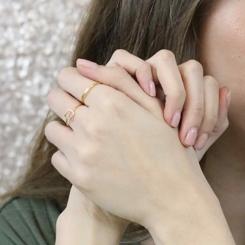 Model Wearing Simple Elegant Square Stacker Solid Gold Ring By Jewelry Lane