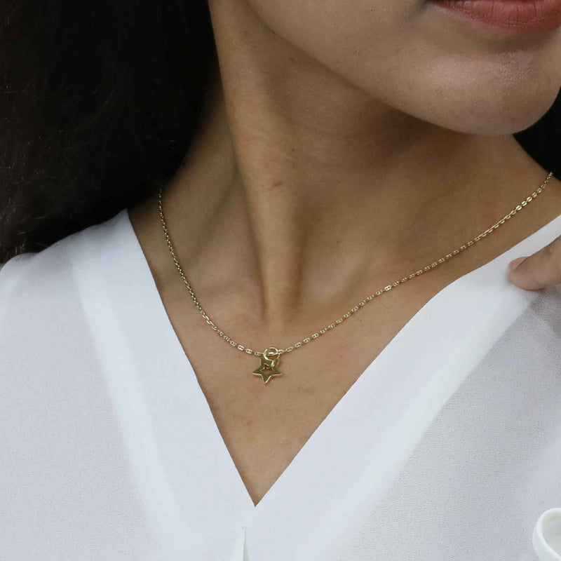 Model Wearing Beautiful Charm Star Design Solid Gold Pendant By Jewelry Lane