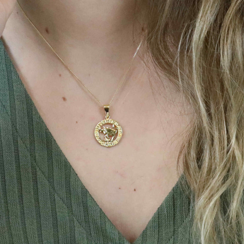 Model Wearing Beautiful Zodiac Taurus Solid Gold Pendant By Jewelry Lane