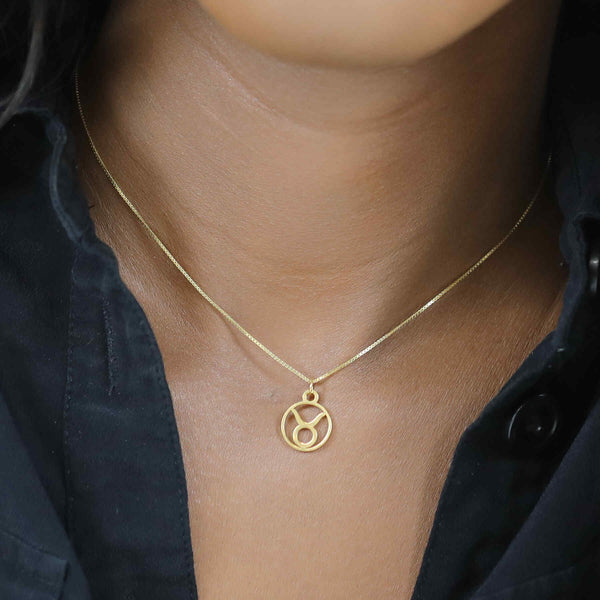 Model Wearing Charming Zodiac Taurus Minimalist Solid Gold Pendant By Jewelry Lane