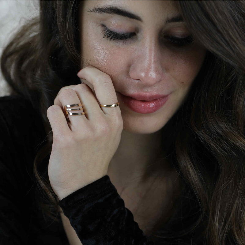 Model Wearing Beautiful Triple Flat Flared Solid Gold Ring By Jewelry Lane