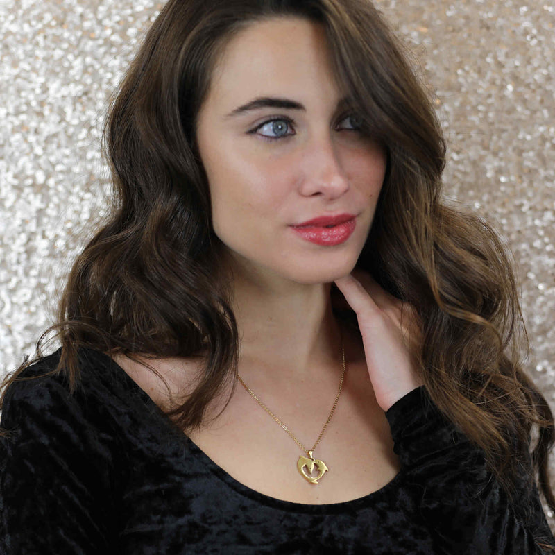 Model Wearing Elegant Twin Dolphin Heart Solid Gold Pendant By Jewelry Lane