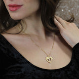 Model Wearing Elegant Twin Dolphin Heart Solid Gold Pendant By Jewelry Lane