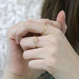Model Wearing Beautiful Wire Style Heart Stracker Solid Gold Ring By Jewelry Lane