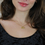 Model Wearing Beautiful XO Hugs And Kisses Solid Gold Pendant By Jewelry Lane