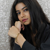 Model Wearing Beautiful Timeless Polished Solid Gold Bangle by Jewelry Lane